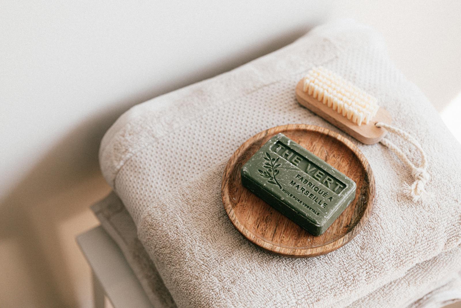 A calming spa scene featuring eco-friendly soap and neatly folded towels, evoking relaxation.