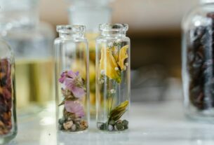 Elegant glass jars with dried flowers for aromatherapy or decoration.